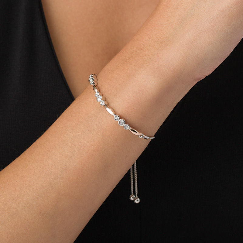 Main Image 2 of 1/20 CT. T.W. Diamond Three Stone and Bar Station Bolo Bracelet in Sterling Silver and 10K Rose Gold - 9.5"