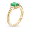 Thumbnail Image 1 of EFFY™ Collection Oval Emerald and 1/10 CT. T.W. Diamond Tri-Sides Ring in 14K Gold