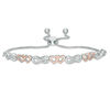 Thumbnail Image 1 of 1/20 CT. T.W. Diamond Double Heart Infinity Alternating Bolo Bracelet in Sterling Silver and 10K Rose Gold - 9.5"