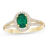 Thumbnail Image 0 of Oval Emerald and 1/8 CT. T.W. Diamond Frame Split Shank Ring in 10K Gold