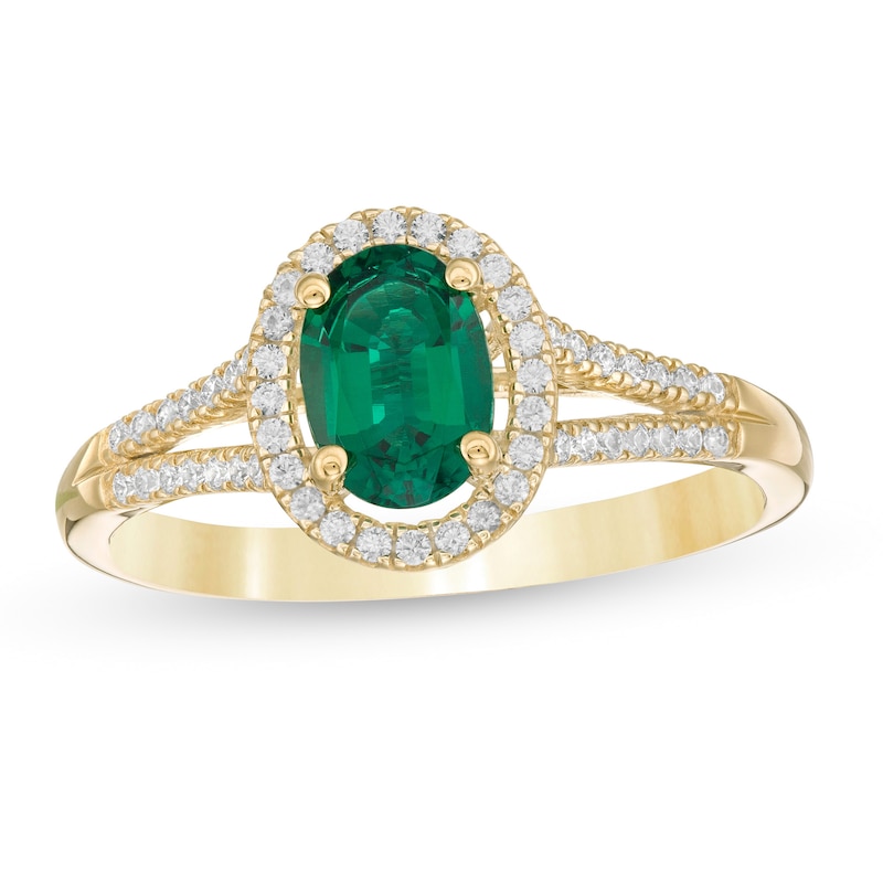 Oval Emerald and 1/8 CT. T.W. Diamond Frame Split Shank Ring in 10K Gold