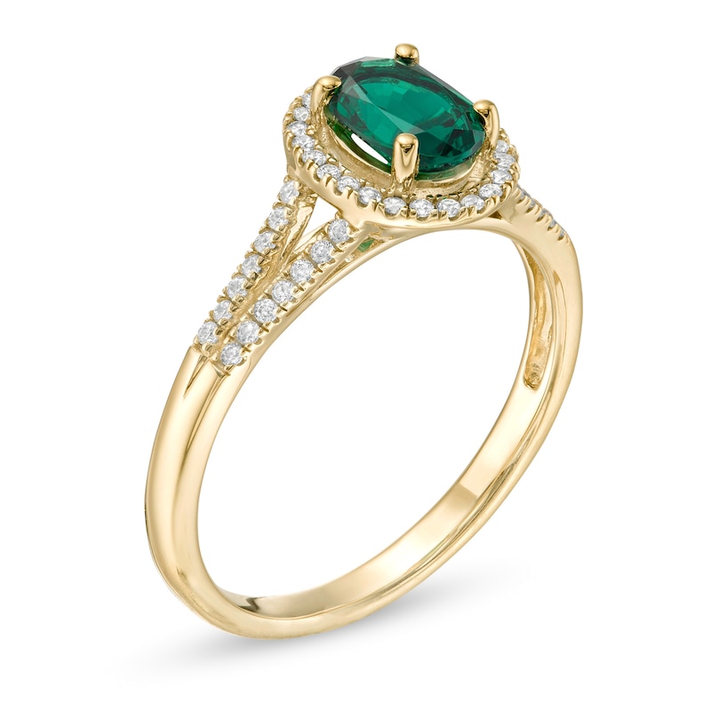 Oval Emerald and 1/8 CT. T.W. Diamond Frame Split Shank Ring in 10K Gold