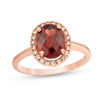 Thumbnail Image 1 of Oval Garnet and 1/8 CT. T.W. Diamond Frame Engagement Ring in 14K Rose Gold