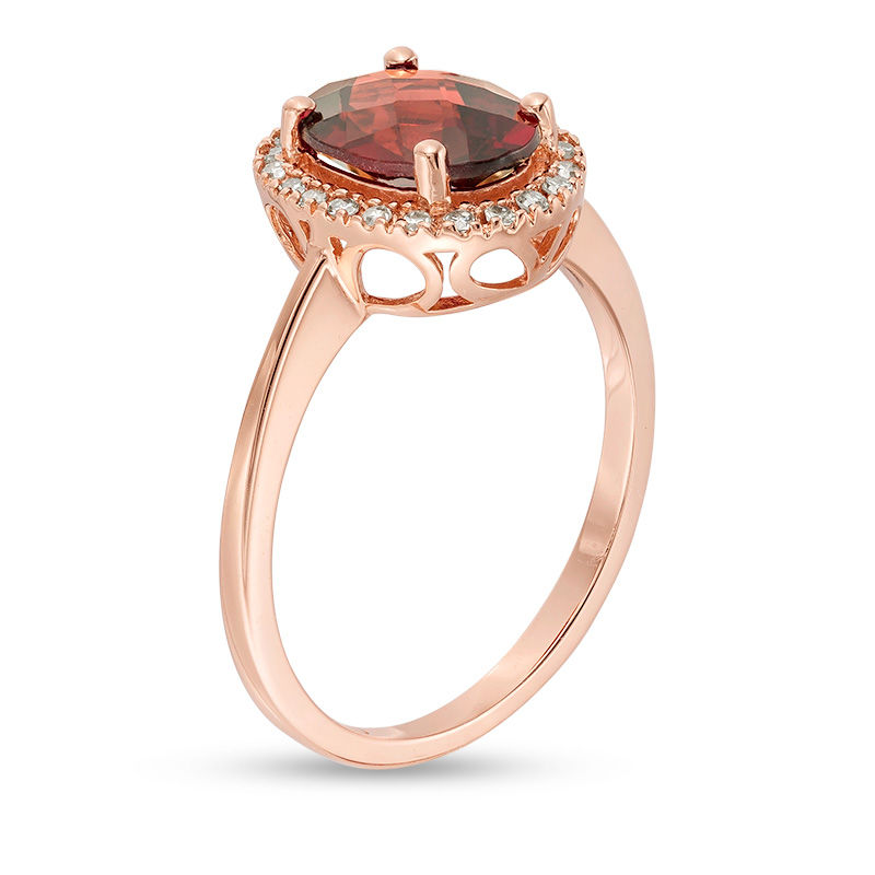 Oval Garnet and 1/8 CT. T.W. Diamond Frame Engagement Ring in 14K Rose Gold