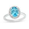 Thumbnail Image 0 of Oval Blue Topaz and 1/8 CT. T.W. Diamond Frame Engagement Ring in 14K White Gold