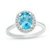 Thumbnail Image 1 of Oval Blue Topaz and 1/8 CT. T.W. Diamond Frame Engagement Ring in 14K White Gold