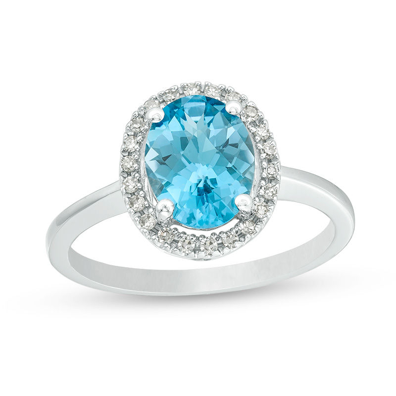Main Image 1 of Oval Blue Topaz and 1/8 CT. T.W. Diamond Frame Engagement Ring in 14K White Gold