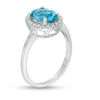Thumbnail Image 1 of Oval Blue Topaz and 1/8 CT. T.W. Diamond Frame Engagement Ring in 14K White Gold