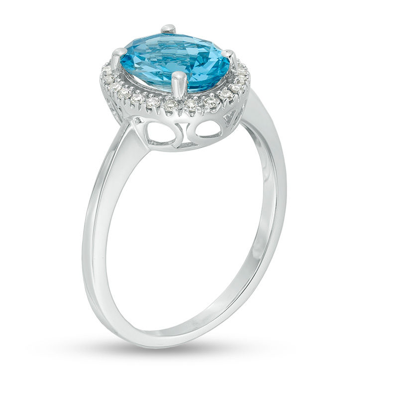 Main Image 2 of Oval Blue Topaz and 1/8 CT. T.W. Diamond Frame Engagement Ring in 14K White Gold