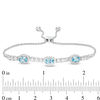 Thumbnail Image 1 of Sideways Oval Swiss Blue Topaz and Lab-Created White Sapphire Frame Three Stone Bolo Bracelet in Sterling Silver - 9.5"