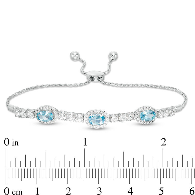 Sideways Oval Swiss Blue Topaz and Lab-Created White Sapphire Frame Three Stone Bolo Bracelet in Sterling Silver - 9.5"