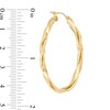 Thumbnail Image 1 of Made in Italy Multi-Finish Ribbon Twist Oval Hoop Earrings in 14K Gold