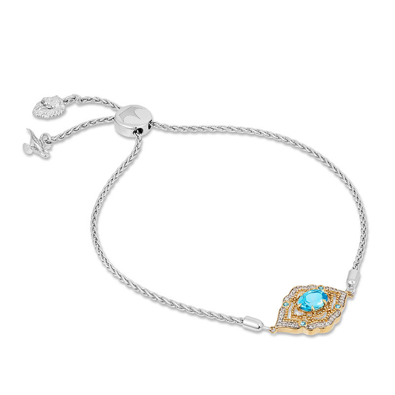 Enchanted Disney Aladdin Oval Swiss Blue Topaz and 1/15 CT. T.W. Diamond Bolo Bracelet in Sterling Silver and 10K Gold