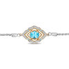 Thumbnail Image 1 of Enchanted Disney Aladdin Oval Swiss Blue Topaz and 1/15 CT. T.W. Diamond Bolo Bracelet in Sterling Silver and 10K Gold