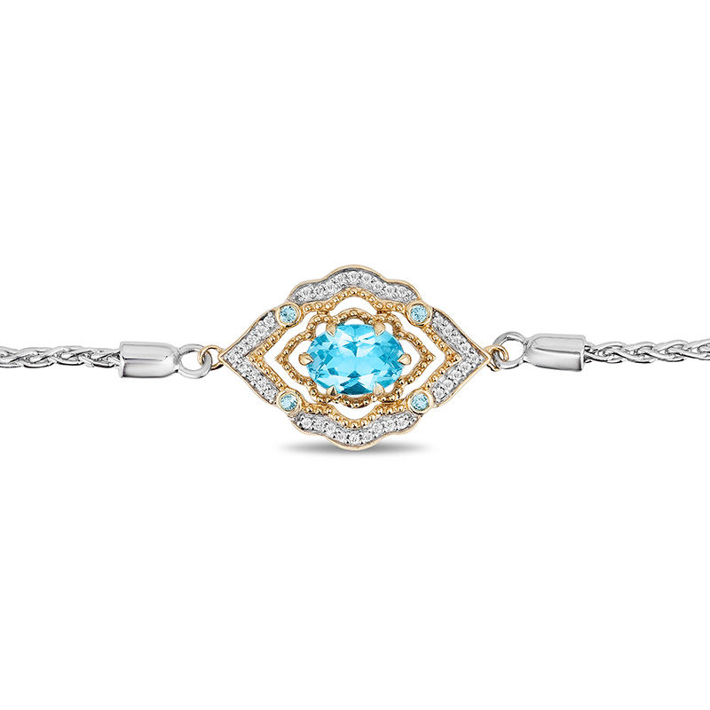 Enchanted Disney Aladdin Oval Swiss Blue Topaz and 1/15 CT. T.W. Diamond Bolo Bracelet in Sterling Silver and 10K Gold