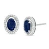 Thumbnail Image 1 of Oval Blue Sapphire and 1/8 CT. T.W. Diamond Frame Stud Earrings in 10K White Gold