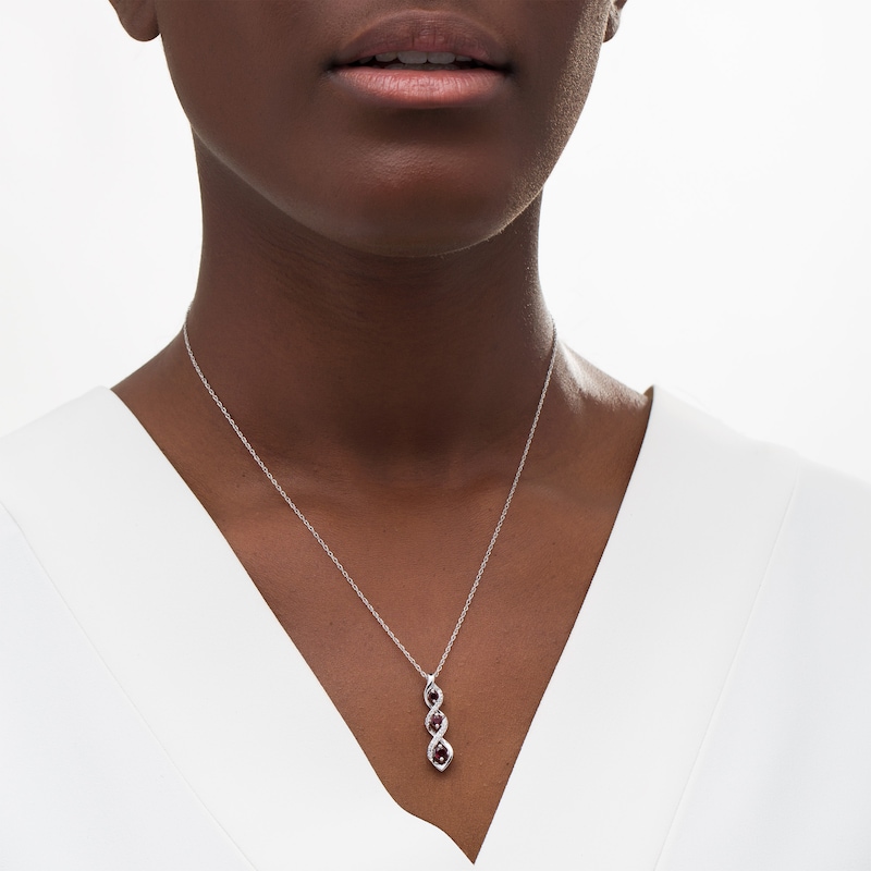 Main Image 2 of Garnet and White Lab-Created Sapphire Graduated Three Stone Cascading Flame Pendant in Sterling Silver