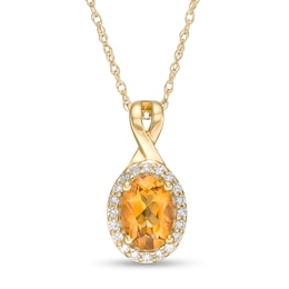 Oval Citrine and 1/15 CT. T.W. Diamond Frame Pendant in 10K Gold