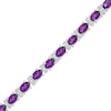 Thumbnail Image 0 of Oval Amethyst and Diamond Accent Tennis Bracelet in Sterling Silver - 7.5"