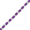 Thumbnail Image 1 of Oval Amethyst and Diamond Accent Tennis Bracelet in Sterling Silver - 7.5"