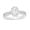 Thumbnail Image 0 of 3/4 CT. T.W. Certified Oval Diamond Frame Engagement Ring in 14K White Gold (I/I2)