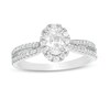 Thumbnail Image 0 of 3/4 CT. T.W. Certified Oval Diamond Frame Engagement Ring in 14K White Gold (I/I2)