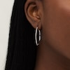 Thumbnail Image 1 of 1/20 CT. T.W. Diamond Hoop Earrings in Sterling Silver