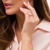Thumbnail Image 1 of 1/4 CT. T.W. Diamond Three Stone Hearts Frame Promise Ring in 10K Rose Gold