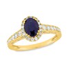 Thumbnail Image 1 of Oval Blue Sapphire and 3/8 CT. T.W. Diamond Frame Vintage-Style Ring in 14K Gold