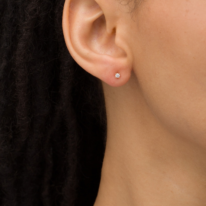 Main Image 2 of 1/10 CT. T.W. Diamond Solitaire Stud Earrings in 14K Gold (J/I2)