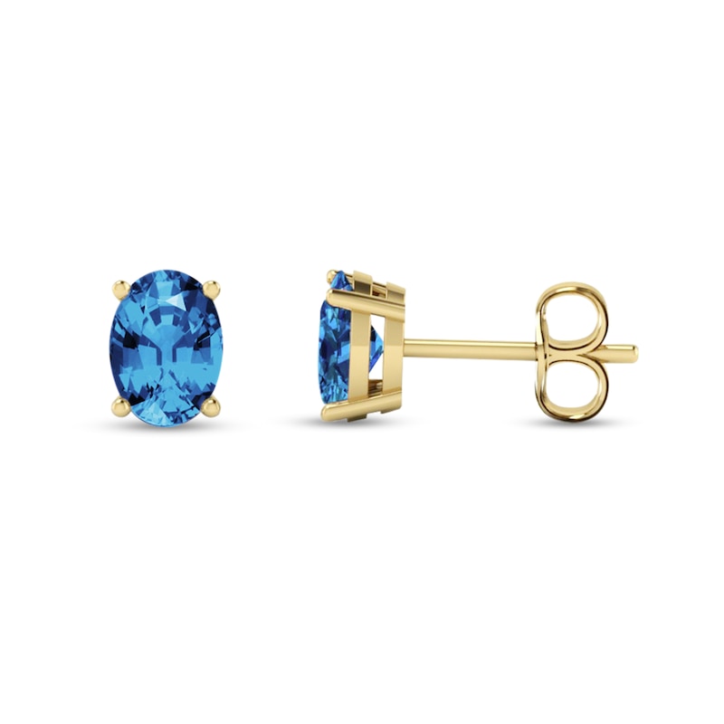 Main Image 1 of Oval Swiss Blue Topaz Solitaire Stud Earrings in 14K Gold