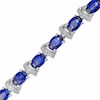 Thumbnail Image 0 of Oval Blue Lab-Created Sapphire and Diamond Accent Ribbon Alternating Line Bracelet in Sterling Silver - 7.25"