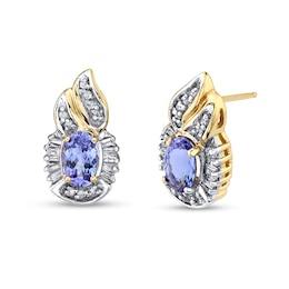 Oval Tanzanite and 1/3 CT. T.W. Baguette and Round Diamond Frame Flame-Top Stud Earrings in 14K Gold