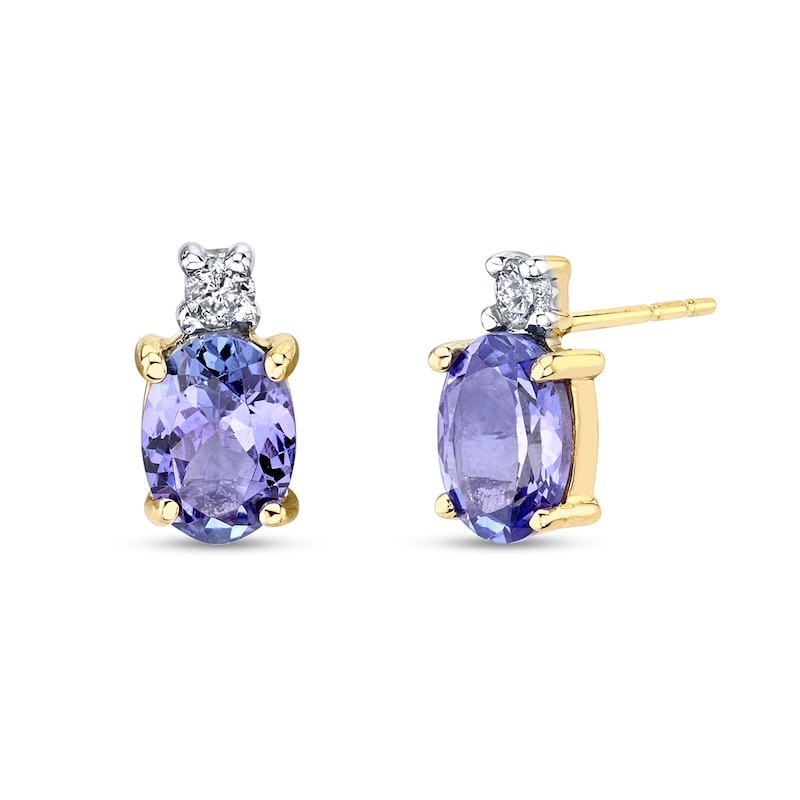 Main Image 1 of Oval Tanzanite and 1/10 CT. T.W. Diamond Accent Stud Earrings in 14K Gold