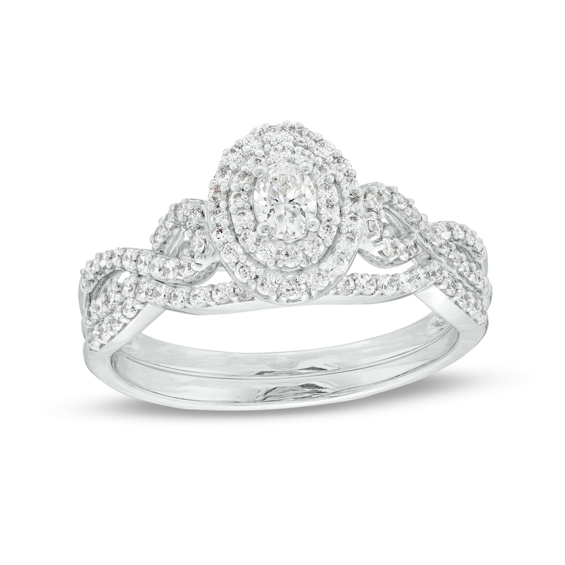 Main Image 1 of 5/8 CT. T.W. Oval Diamond Double Frame Twist Shank Bridal Set in 10K White Gold