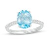 Thumbnail Image 1 of Oval Swiss Blue Topaz and White Lab-Created Sapphire Tapered Shank Ring in Sterling Silver
