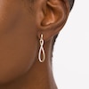 Thumbnail Image 2 of 1/6 CT. T.W. Diamond Elongated Infinity Drop Earrings in 10K Gold