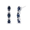 Thumbnail Image 1 of Oval Blue Sapphire and 1/20 CT. T.W. Diamond Three Stone J-Hoop Earrings in 14K White Gold