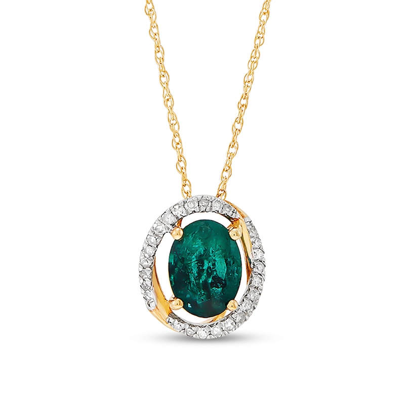 Main Image 1 of Oval Emerald and 1/8 CT. T.W. Diamond Open Swirl Frame Pendant in 10K Gold