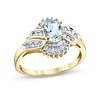 Thumbnail Image 1 of Oval Aquamarine and 1/3 CT. T.W. Baguette and Round Diamond Frame Double Bypass Ring in 14K Gold