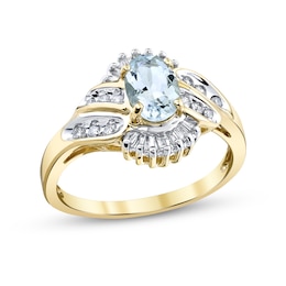 Oval Aquamarine and 1/3 CT. T.W. Baguette and Round Diamond Frame Double Bypass Ring in 14K Gold