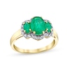 Thumbnail Image 0 of Oval Emerald and 1/4 CT. T.W. Diamond Frame Three Stone Ring in 14K Gold
