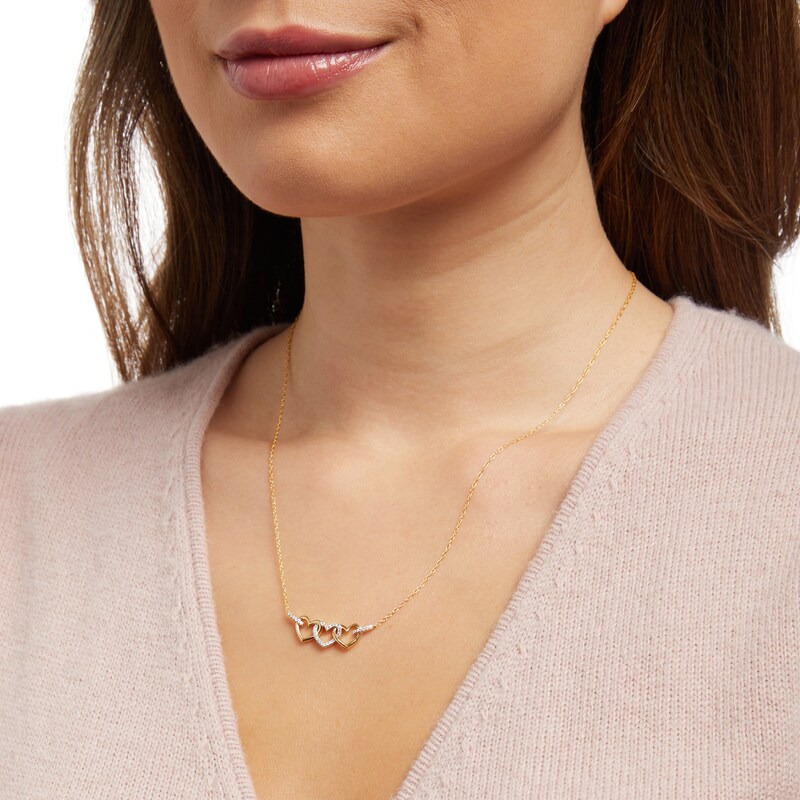 Main Image 2 of 1/10 CT. T.W. Diamond Triple Heart Link Necklace in 10K Gold