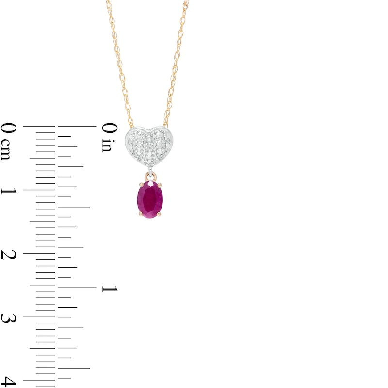 Oval Ruby and Diamond Accent Beaded Heart Dangle Pendant in 10K Gold