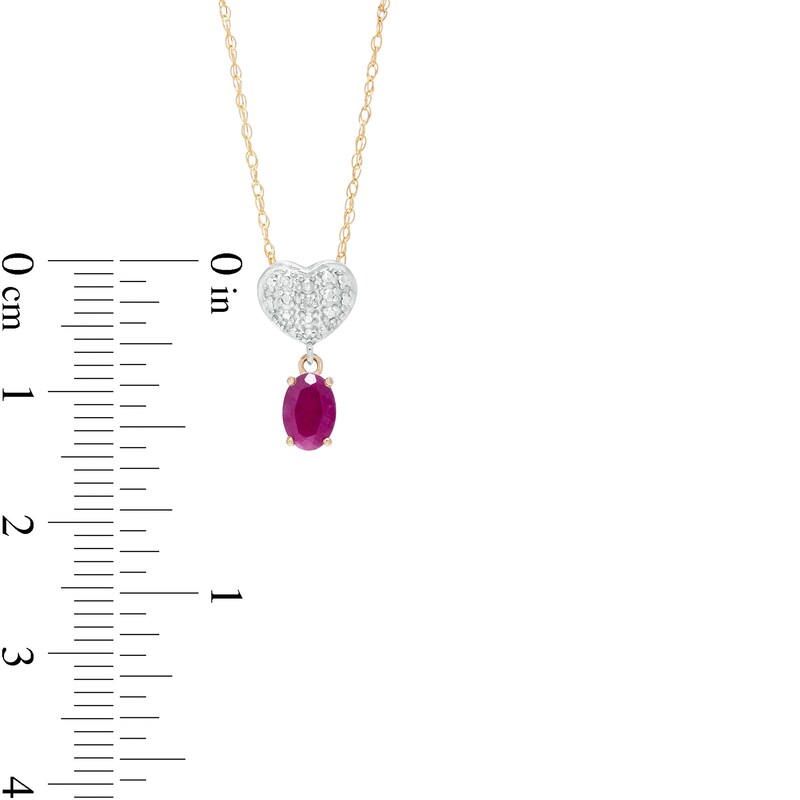 Oval Ruby and Diamond Accent Beaded Heart Dangle Pendant in 10K Gold