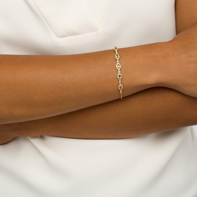 Main Image 2 of Oval Citrine and Diamond Accent Twist Five Stone Bracelet in 10K Gold – 8.0"