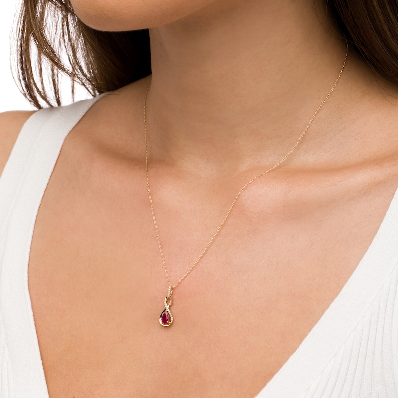 Main Image 2 of Pear-Shaped Ruby and 1/20 CT. T.W. Diamond Twist Pendant in 10K Gold