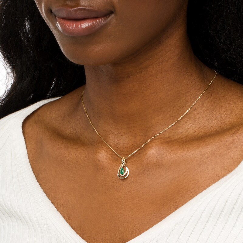 Main Image 2 of Pear-Shaped Emerald and 1/8 CT. T.W. Diamond Infinity Pendant in 10K Gold