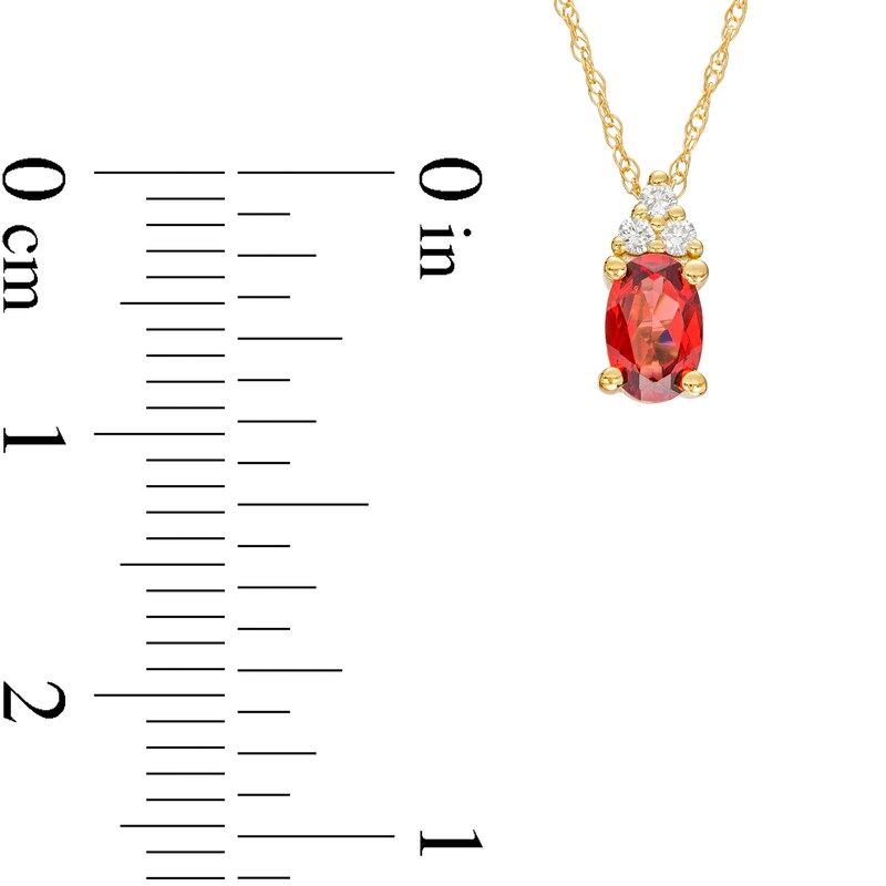 Oval Garnet and 1/20 CT. T.W. Diamond Pendant in 10K Gold
