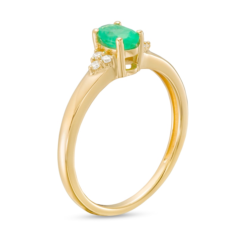 Main Image 3 of Oval Emerald and 1/20 CT. T.W. Diamond Tri-Sides Ring in 10K Gold - Size 7